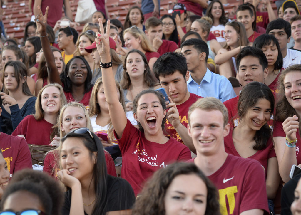 Student throwing USC victory hand sign