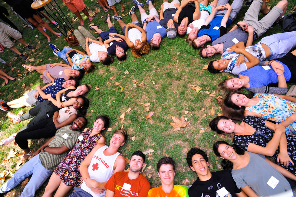 Students lying down in circle